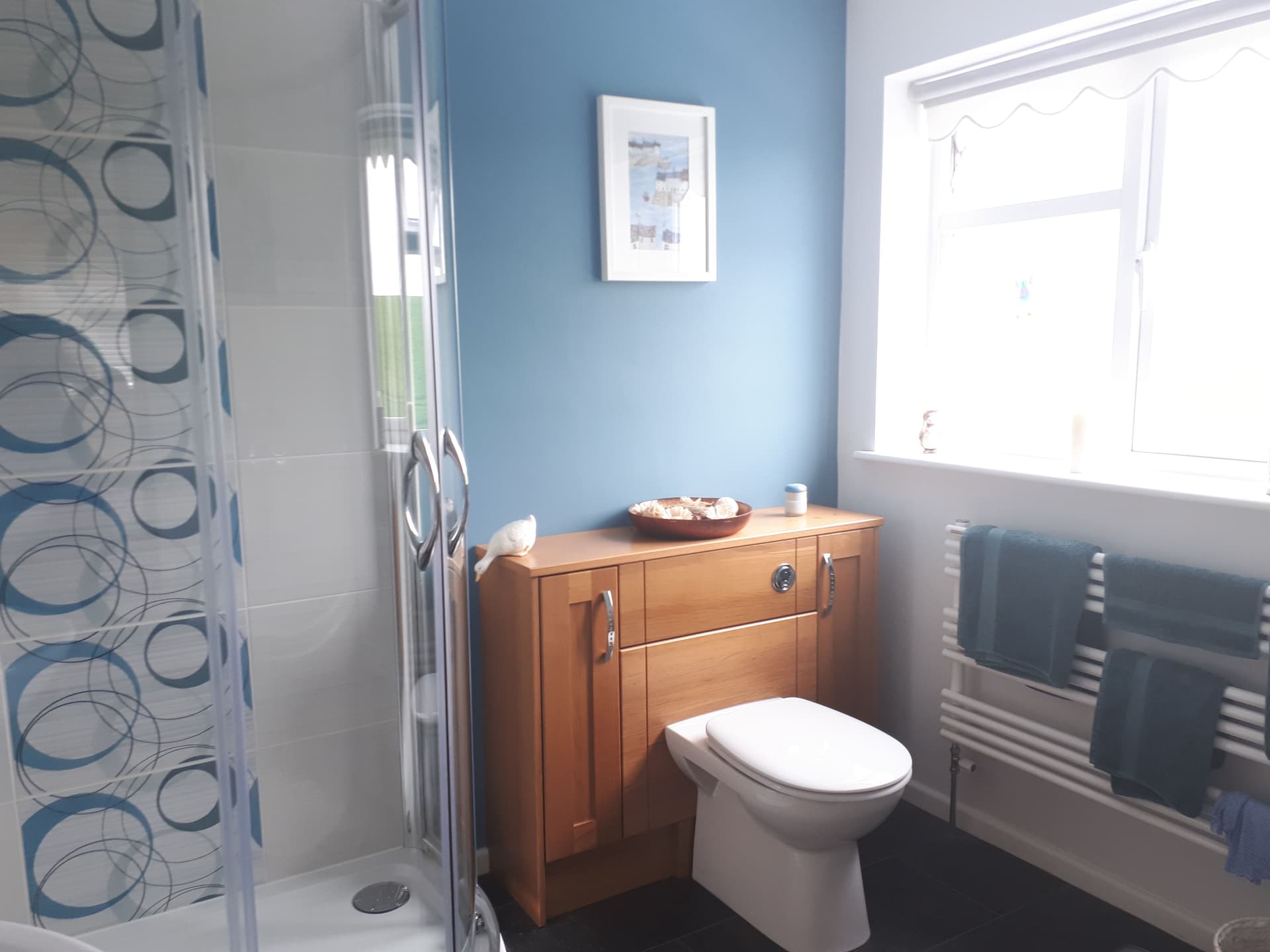 Modern bathroom with blue wall